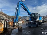 2025 Fuchs MHL320 SS wheel excavator, front three-quarter view