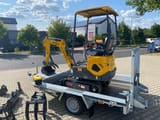Berger Kraus BK1000JS mini excavator on a trailer, side view