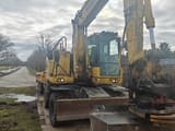 2017 Komatsu PW148-10 wheel excavator, front three-quarter view