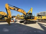 2012 Caterpillar 323DL crawler excavator, side view