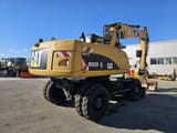 2011 Caterpillar M322D wheel excavator rear three-quarter view