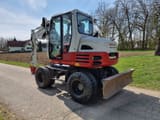 2015 Takeuchi TB295W wheel excavator, rear three-quarter view