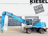 2015 Fuchs MHL340 E material handler, side profile view