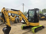 2023 Caterpillar 303.5E mini excavator, side view