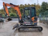 2023 Develon DX50Z-7 mini excavator, side view