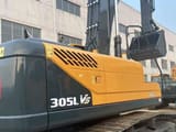 2024 Hyundai 305LVS crawler excavator, rear three-quarter view