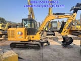 2023 Caterpillar 305.5E2 mini excavator, side view