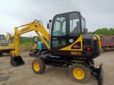 2016 Hyundai 60W-7 wheel excavator, side profile view
