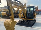 2023 Caterpillar 306E2 mini excavator, front three-quarter view
