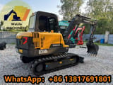 2023 Volvo EC55DL mini excavator, rear three-quarter view