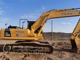 Komatsu PC220 crawler excavator side view