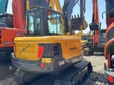 2022 Volvo EC60C mini excavator, rear three-quarter view