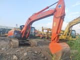 Hitachi ZX210 crawler excavator, side view