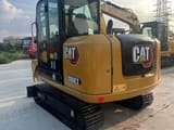 2023 Caterpillar 306E2 mini excavator, rear three-quarter view