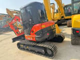 2022 Kubota U55-4 mini excavator, rear three-quarter view