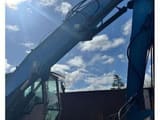 2010 Fuchs MHL320 material handler, side view of boom and cab
