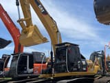 2023 Caterpillar 323D2L crawler excavator, front three-quarter view