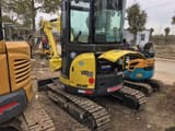 2022 Yanmar VIO35 mini excavator, side view with open engine compartment