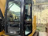 2019 Caterpillar 310 crawler excavator cab view