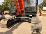 2013 Hitachi ZX240 crawler excavator, front view of undercarriage and cab