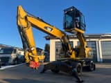 2013 Caterpillar M318D wheel excavator with elevated cab, side view