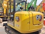 2024 Caterpillar 305.5E2 mini excavator, rear three-quarter view
