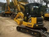 Komatsu PC-55MR mini excavator, three-quarter view