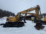 2005 Caterpillar M313C wheel excavator, side profile view