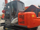 2023 Hitachi ZX60 mini excavator, rear three-quarter view