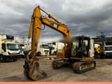 2005 Caterpillar 311C crawler excavator, side view