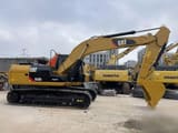 2023 Caterpillar 323DL crawler excavator, side profile view