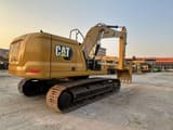 2023 Caterpillar 330 crawler excavator, rear three-quarter view