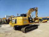 2025 Caterpillar 320D2 L crawler excavator, rear three-quarter view