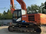 Hitachi Zaxis 210 crawler excavator, side view