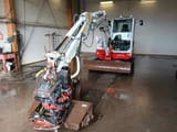 2016 Takeuchi TB260 mini excavator front three-quarter view
