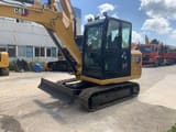 2022 Caterpillar 305.5E2 crawler excavator, front three-quarter view