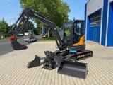 Berger Kraus BK4000KJS mini excavator, side view with attachments