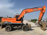 Doosan DX210W wheel excavator, side profile view