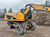 2011 Caterpillar M313D wheel excavator side view