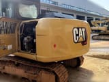 2024 Caterpillar 313GC crawler excavator rear view with engine compartment open
