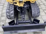 2022 Caterpillar 301.8-05A mini excavator, rear view with dozer blade