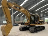 Caterpillar 320BL crawler excavator, side view