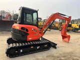 2023 Kubota U40 mini excavator, rear three-quarter view
