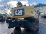 2012 Caterpillar M318D MH material handler rear view