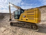 2022 Caterpillar 320 crawler excavator, rear three-quarter view