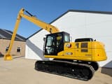 2024 Caterpillar 323D3 crawler excavator, rear three-quarter view