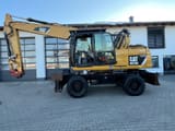 2013 Caterpillar M318D wheel excavator, side profile view