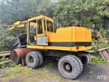 1994 Caterpillar 212B wheel excavator, rear three-quarter view