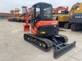 2023 Kubota U55-4 mini excavator, front three-quarter view