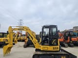 2023 Komatsu PC-55MR mini excavator, side profile view